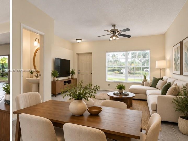 Staged-Dining-living ceramic floor tile, vaulted ceilings, a ceiling fan with integrated lighting
