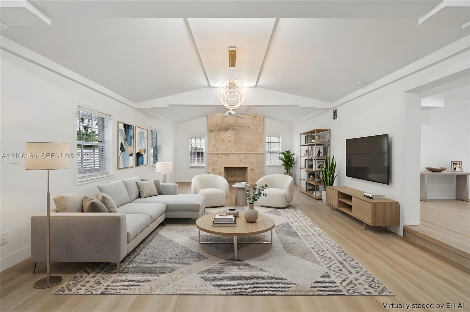 Vaulted ceiling featuring recessed lighting, a stone-faced fireplace, and wood-finish flooring