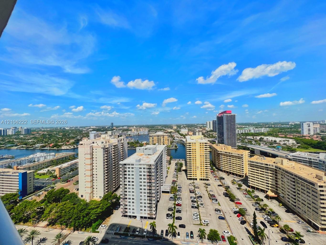 High-rise perspective featuring expansive urban scenery and water elements