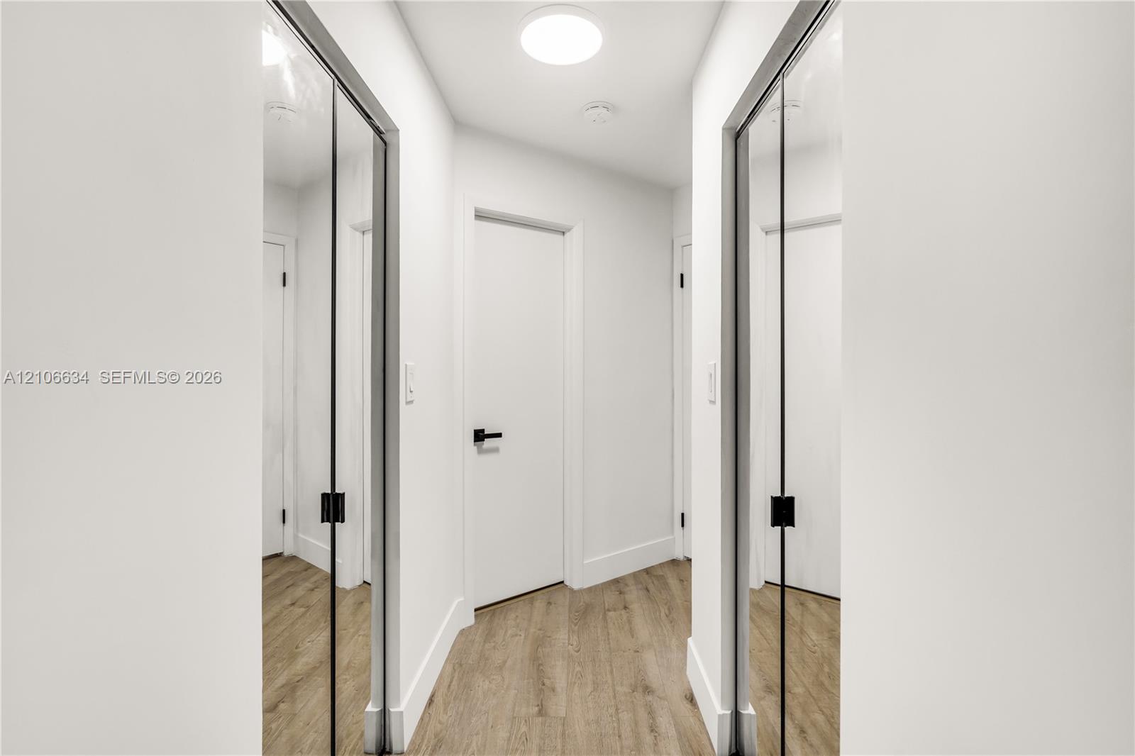 Two walk-in closets at entry way of Primary Bedroom