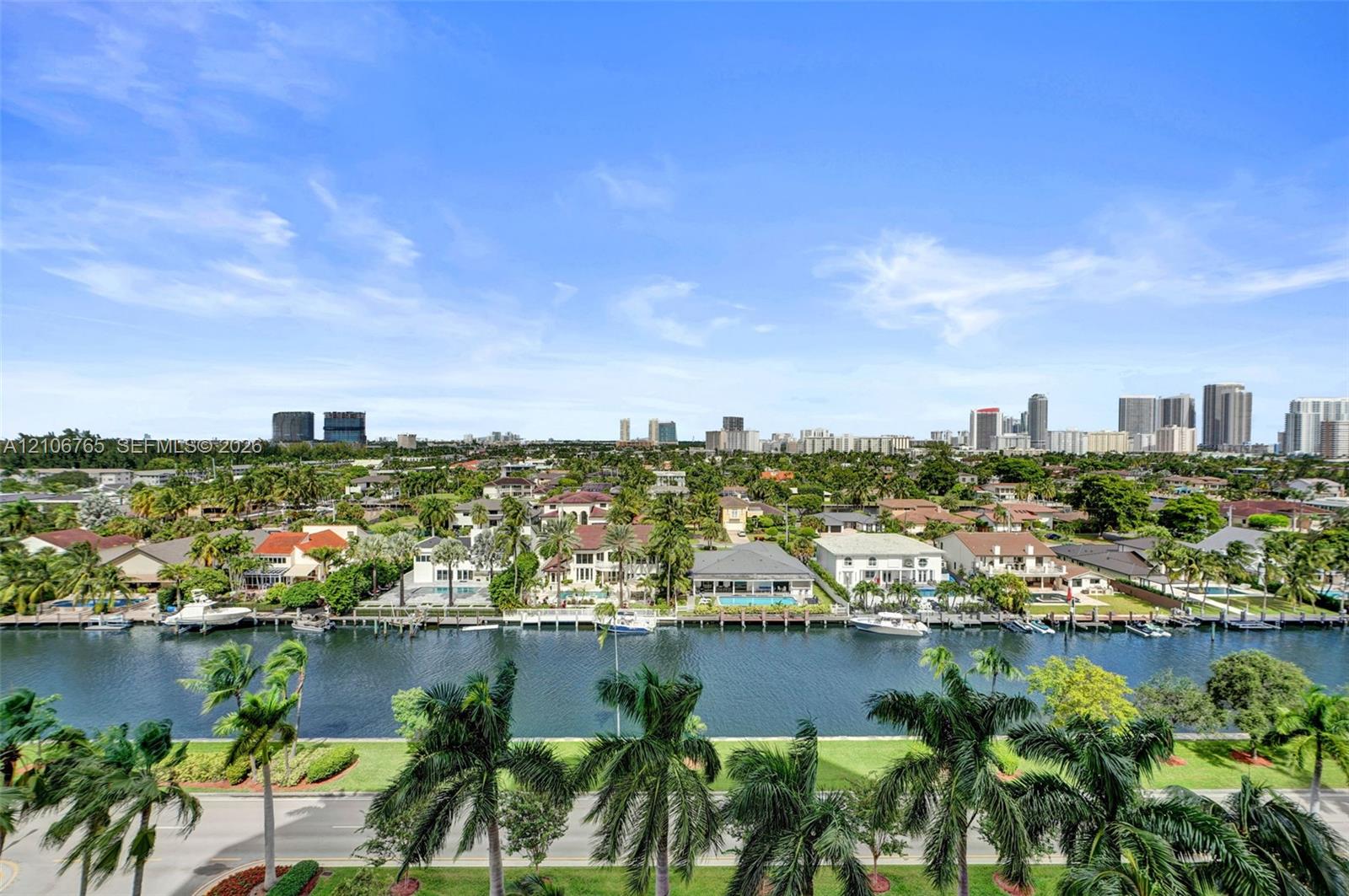 Panoramic views, a deep-water canal, private residential boat docks, and palm trees.