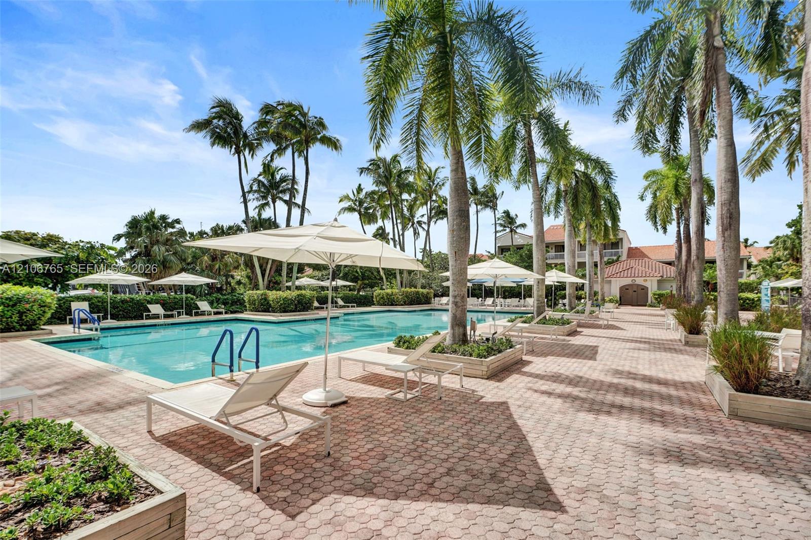 Second pool, palm trees, raised landscape planters.