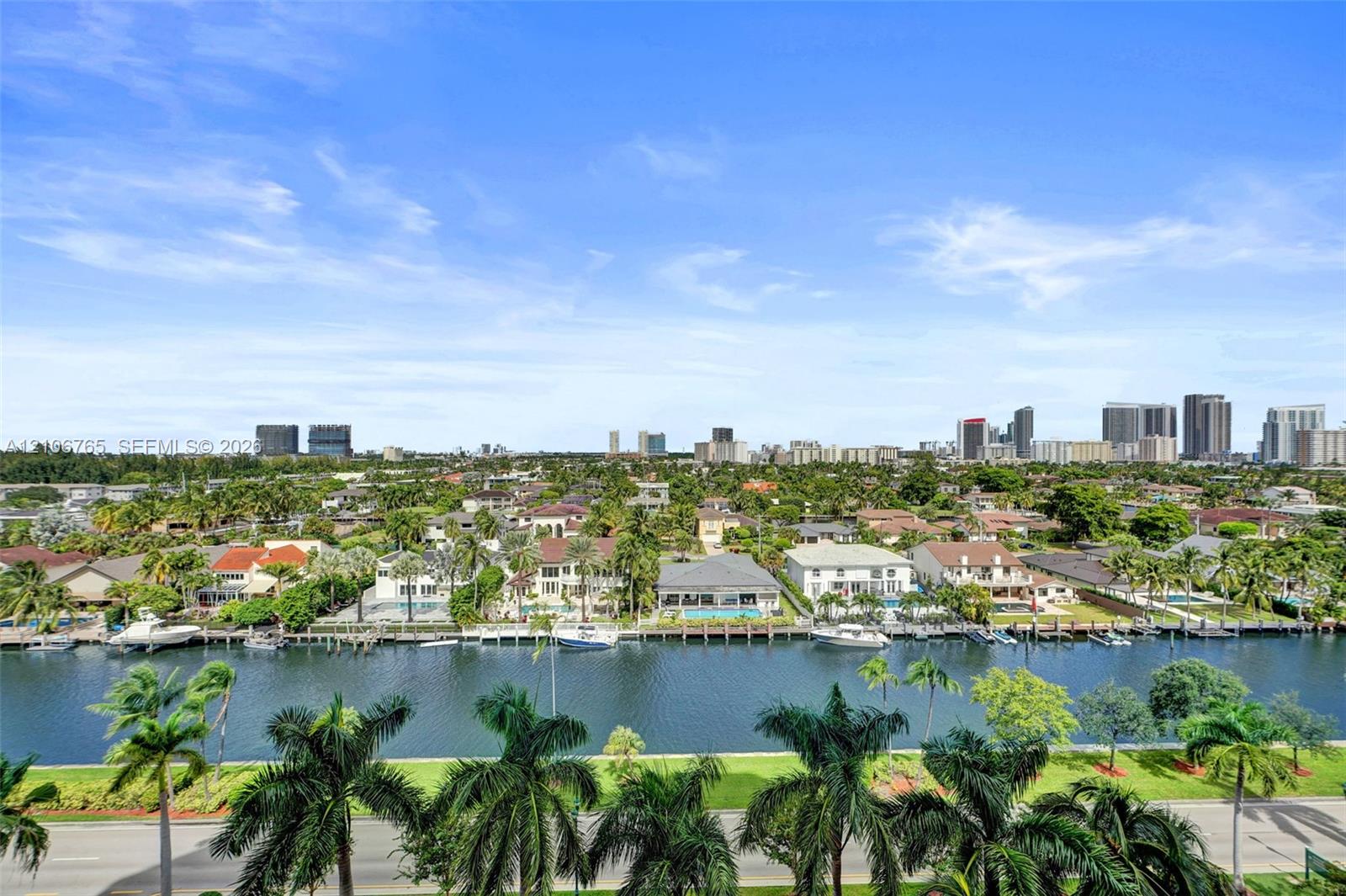 Totally unobstructed views from every room. Canal, private boat slips, tropical landscaping, and a panoramic urban skyline backdrop