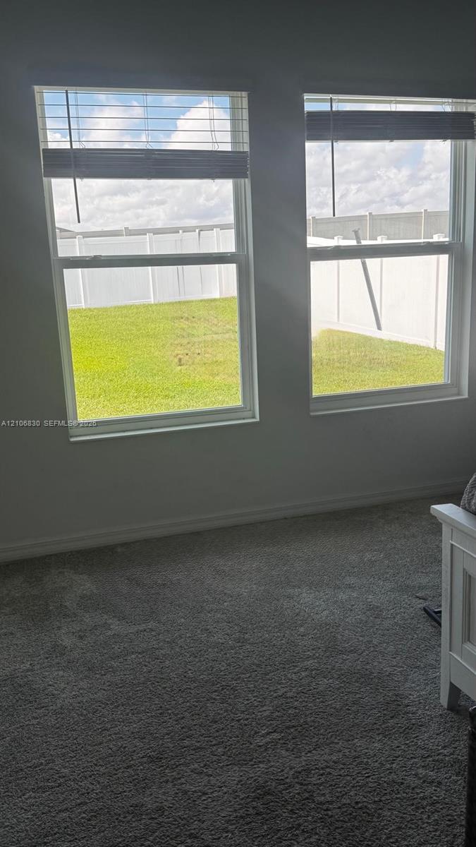 Dual energy-efficient windows, neutral wall coloring, textile flooring, and white vinyl perimeter fencing Dual energy-efficient windows, neutral wall coloring, textile flooring, and white vinyl perimeter fencing