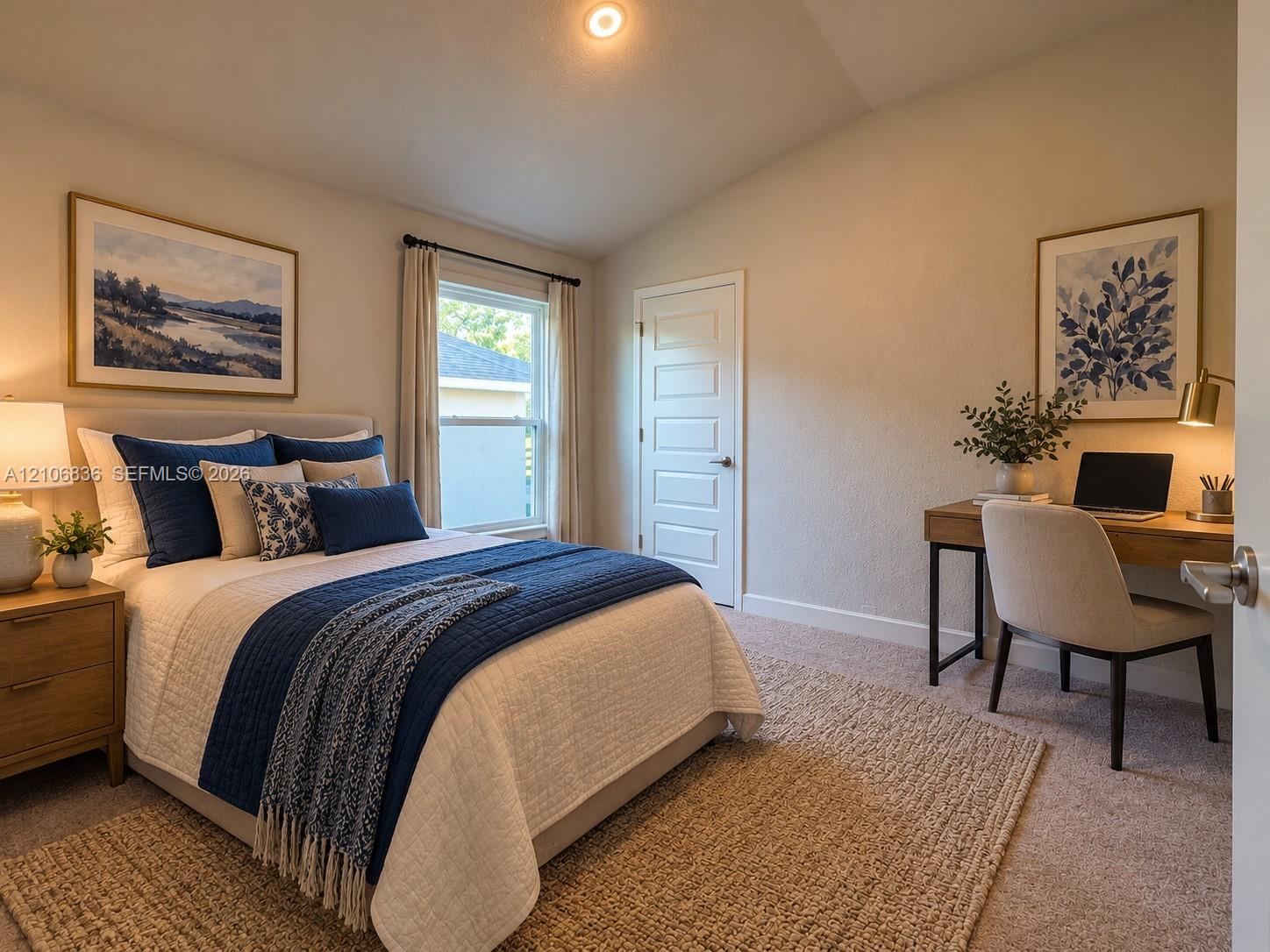 Vaulted ceiling featuring a recessed light fixture, neutral wall finishes, single-panel interior door, and window with casing