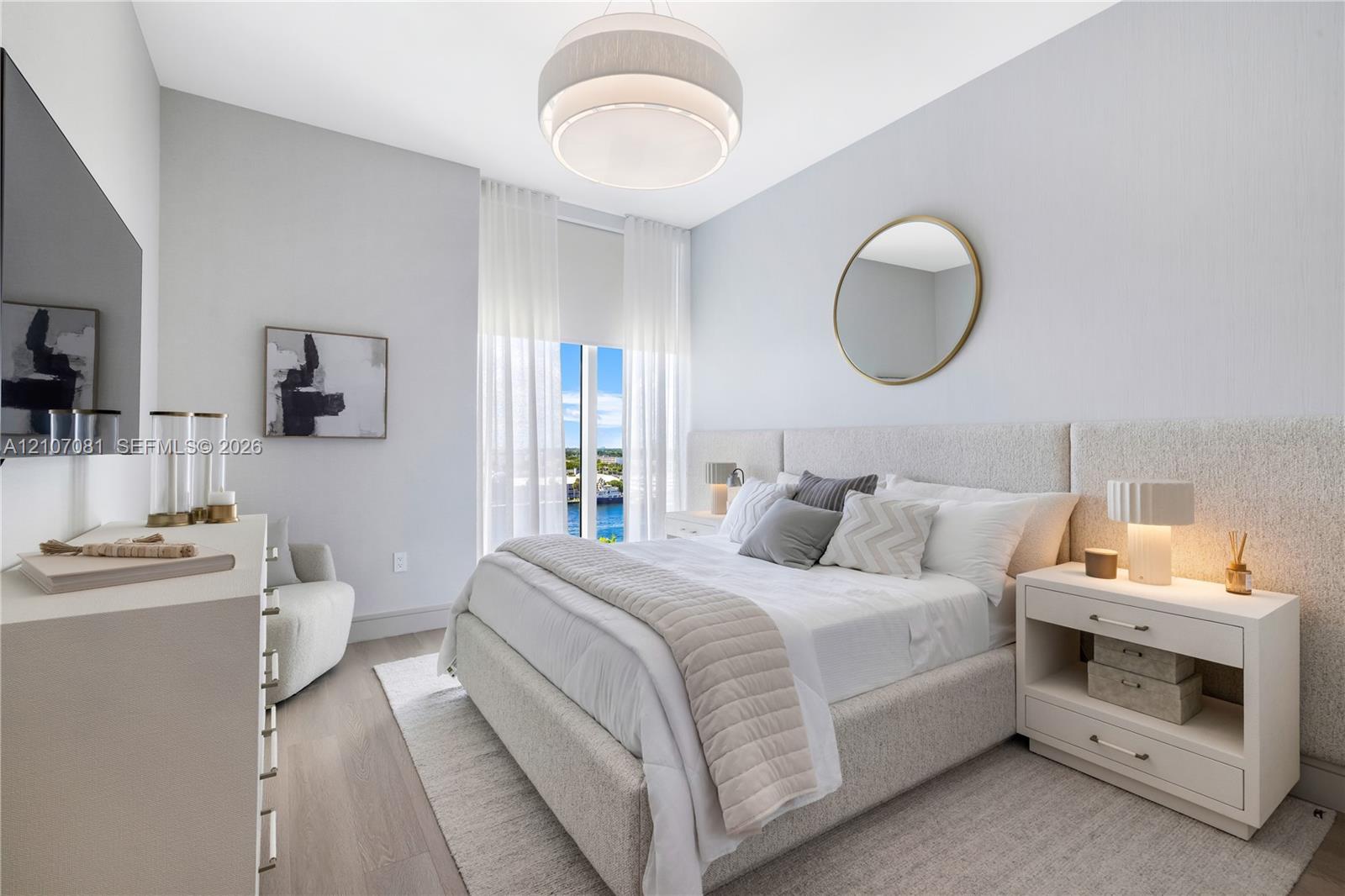 Bedroom featuring wood-finish flooring, floor-to-ceiling windows, a textured fabric headboard wall panel, and a contemporary tiered drum pendant light
