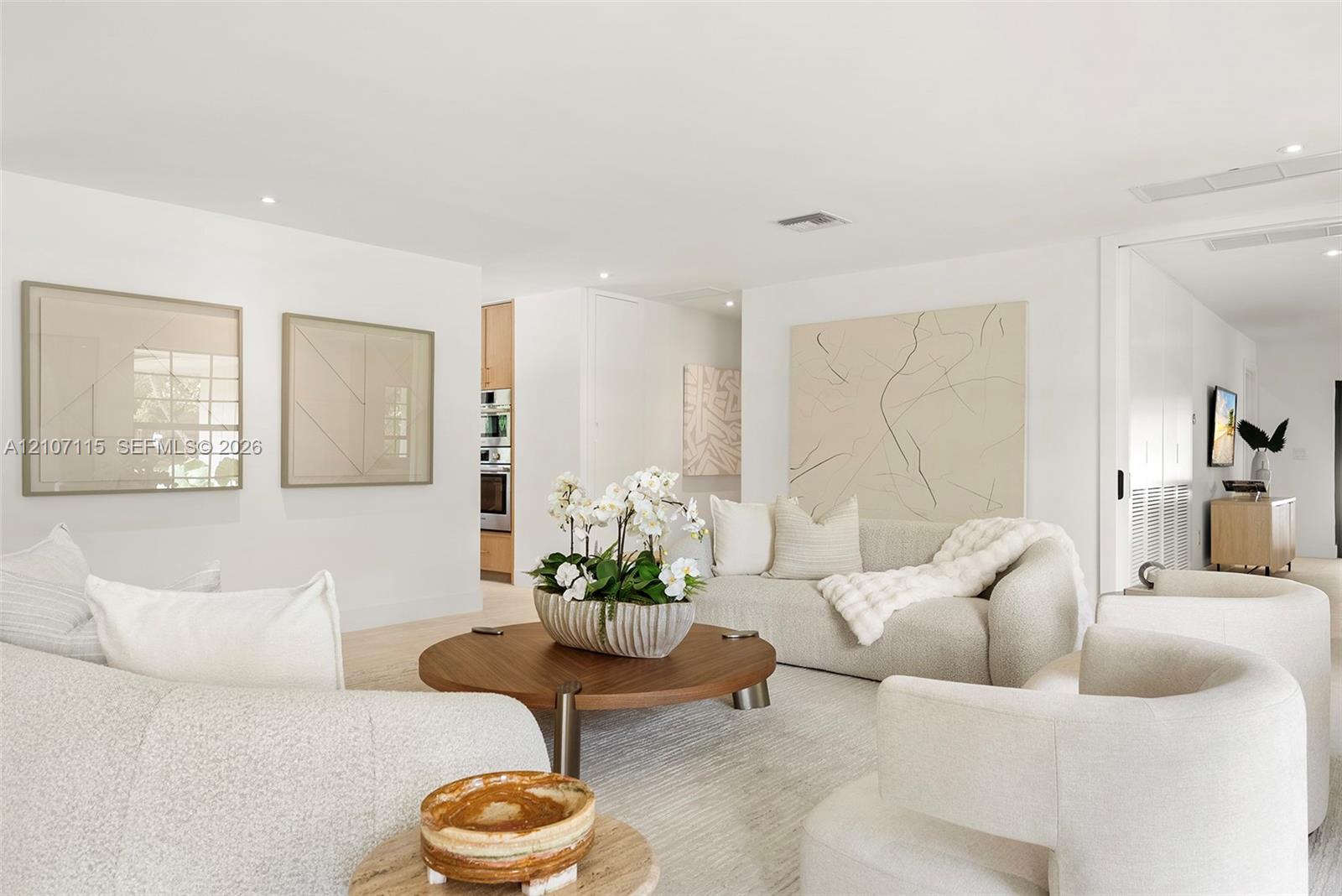 Open floor plan featuring recessed lighting, smooth-finish ceilings, and light-toned flooring