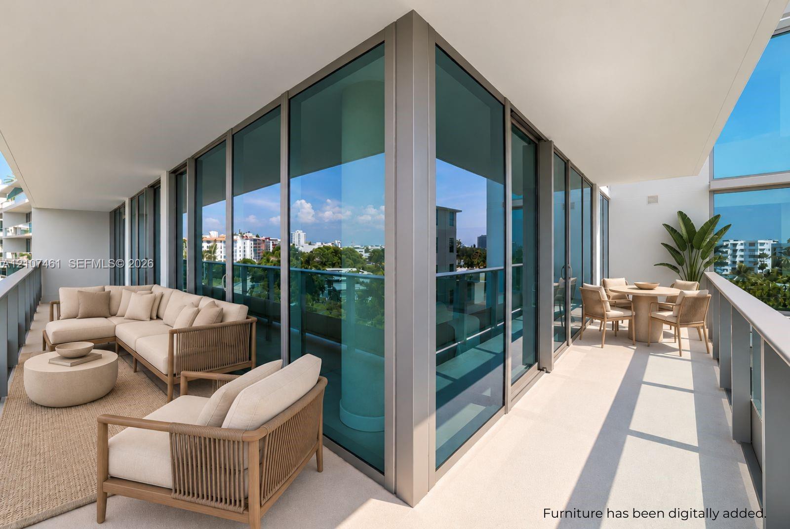 Wrap-around terrace featuring floor-to-ceiling glass paneling, metal frame window systems, and structural concrete overhangs