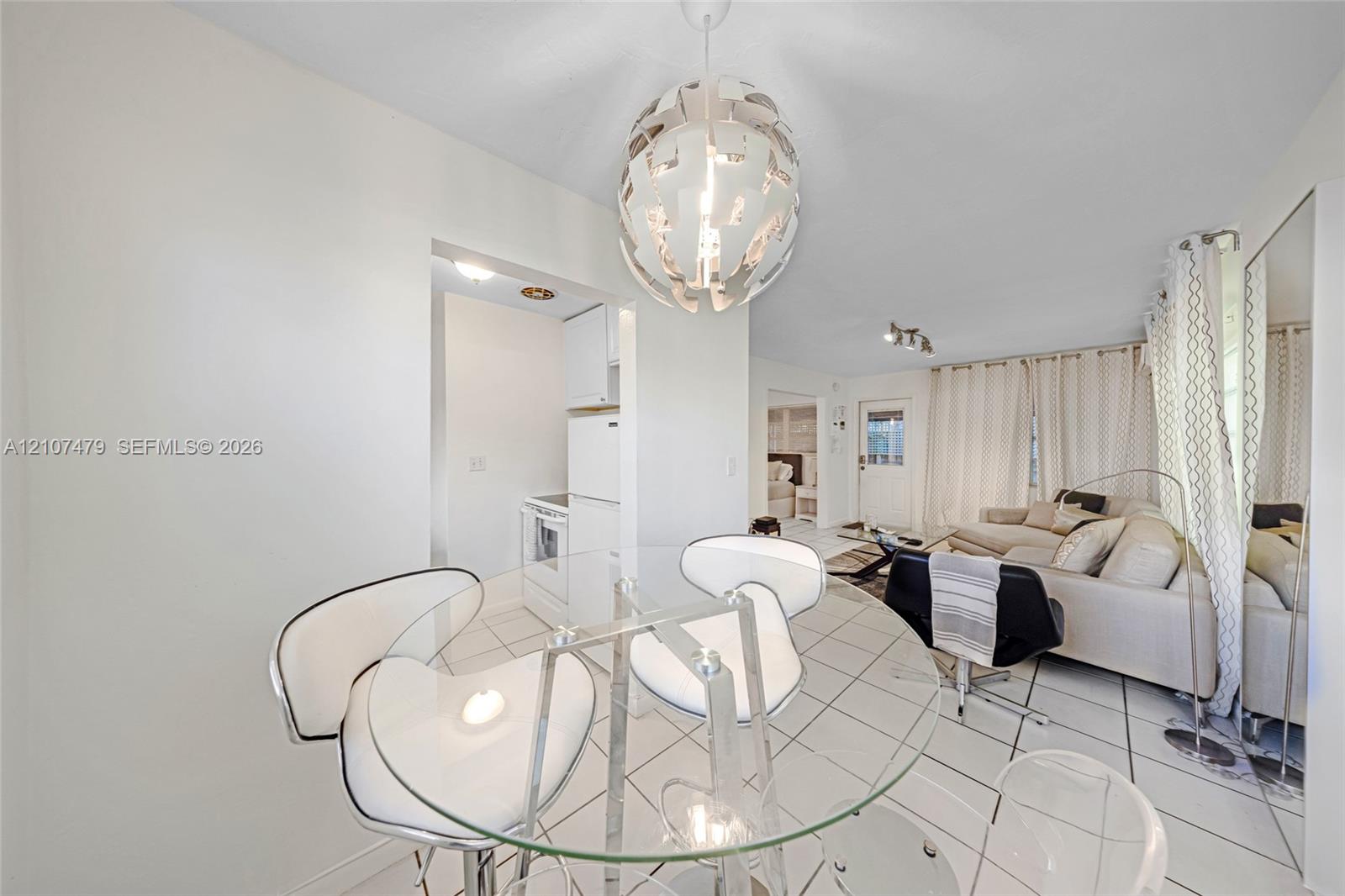 Tiled flooring and large-scale spherical pendant lighting