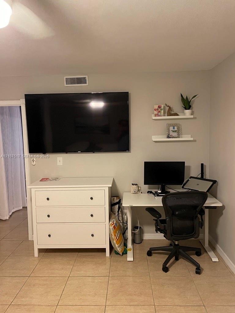 master bedroom with office desk space for remote workers