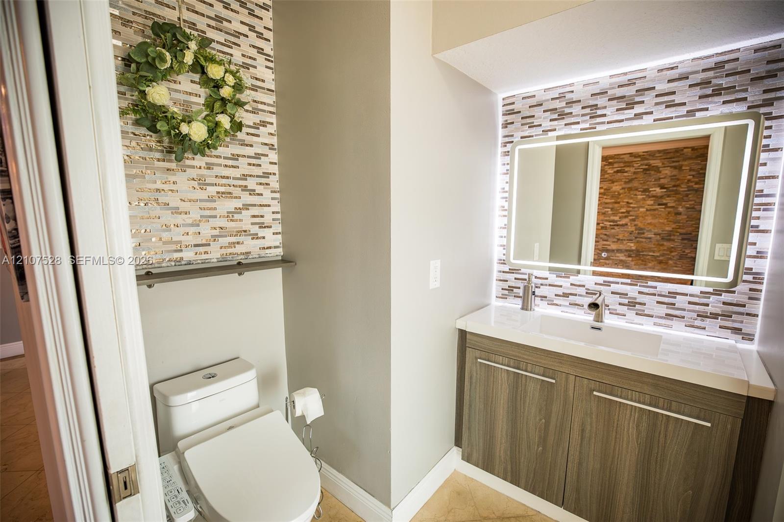 Cabana Half-bathroom with access to Dining Room and Patio