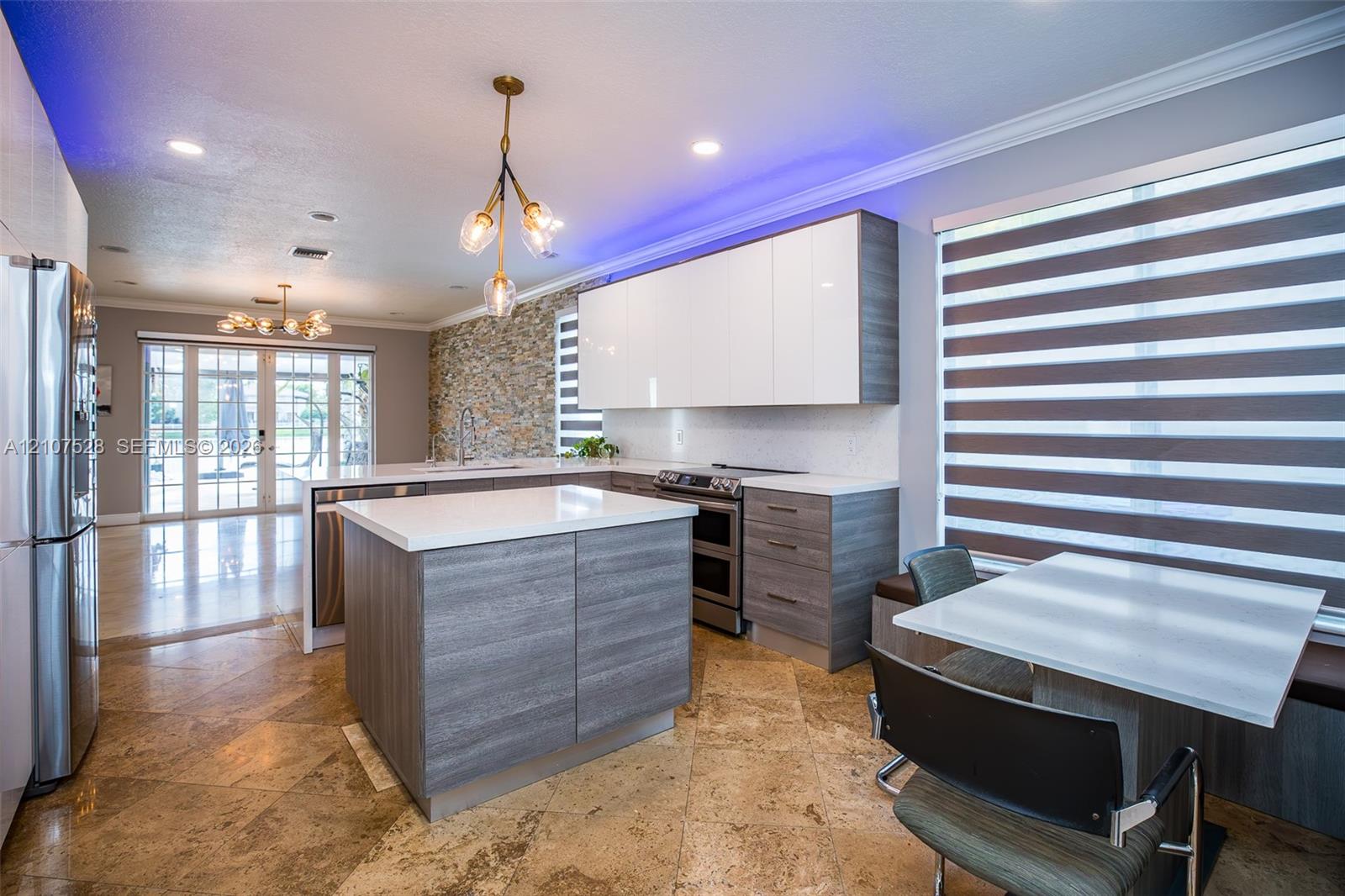 Kitchen has built in appliances and island