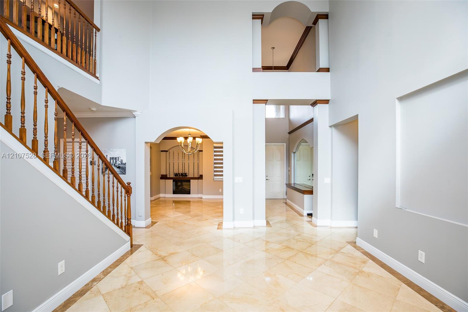 Living Room view of entry and stairs