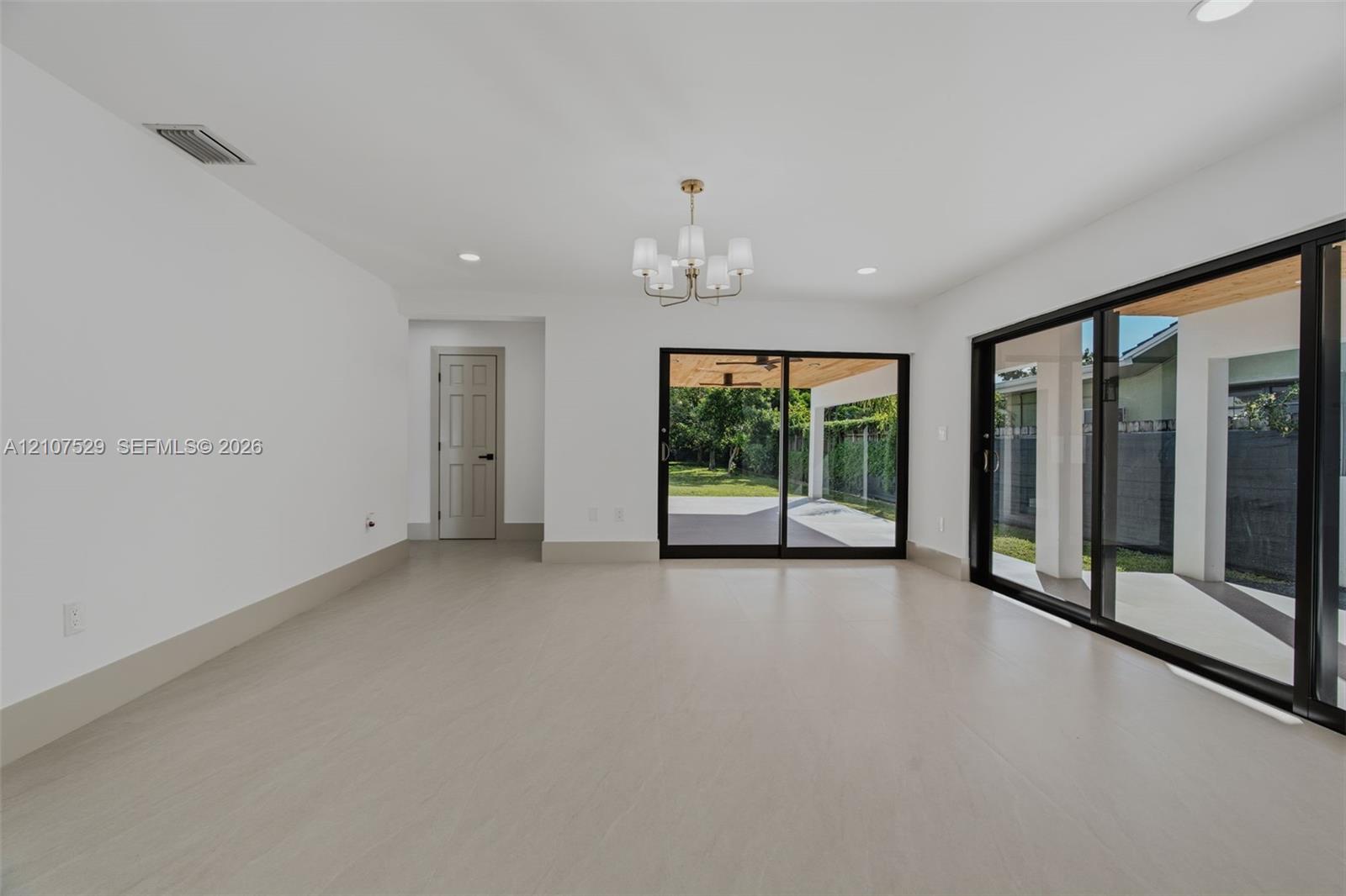 Covered patio featuring a wood-plank ceiling, recessed lighting, matte black ceiling fans, and large-format tile flooring