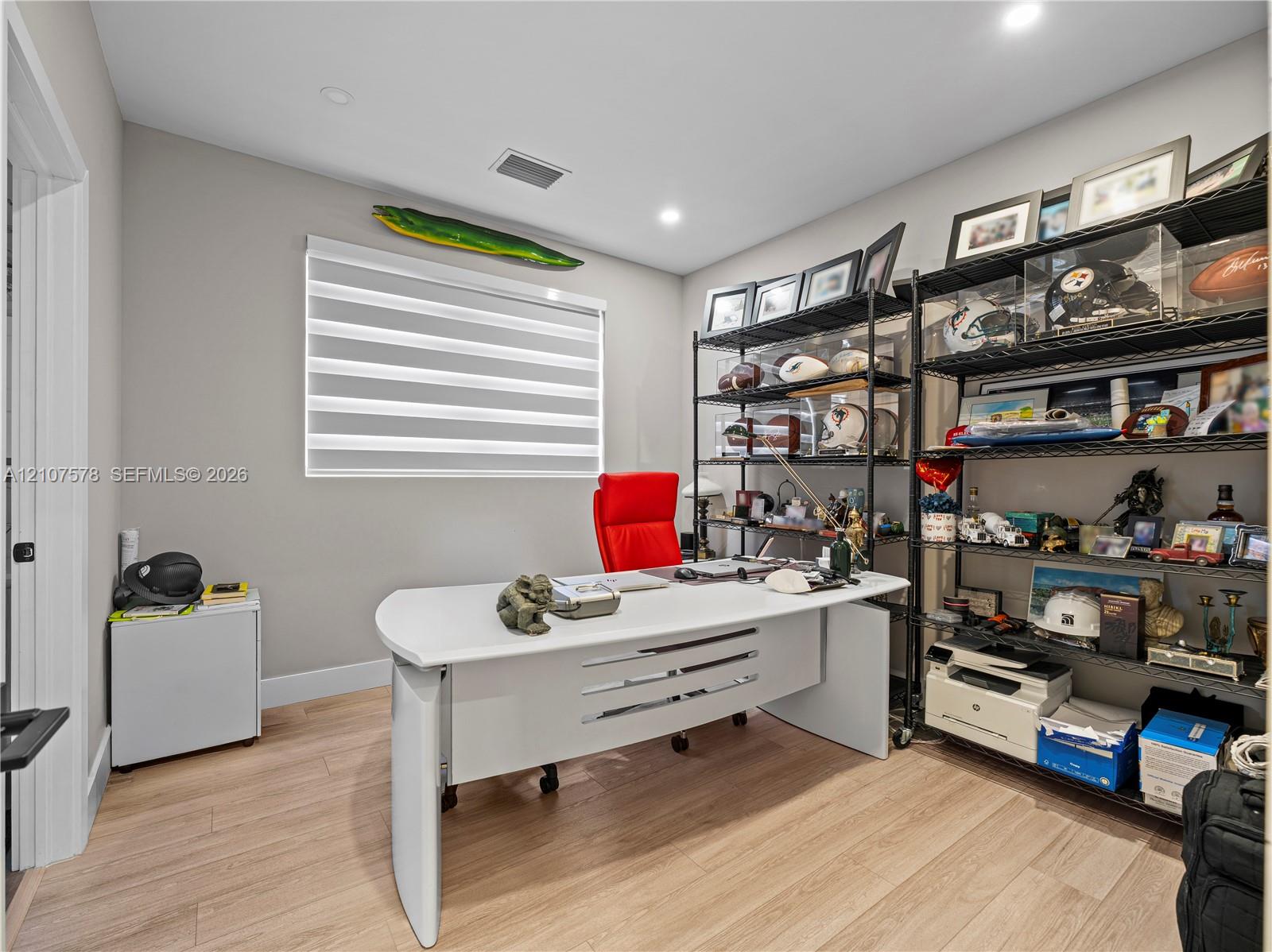 Neutral wall finishes, wood-finish flooring, and horizontal window shades