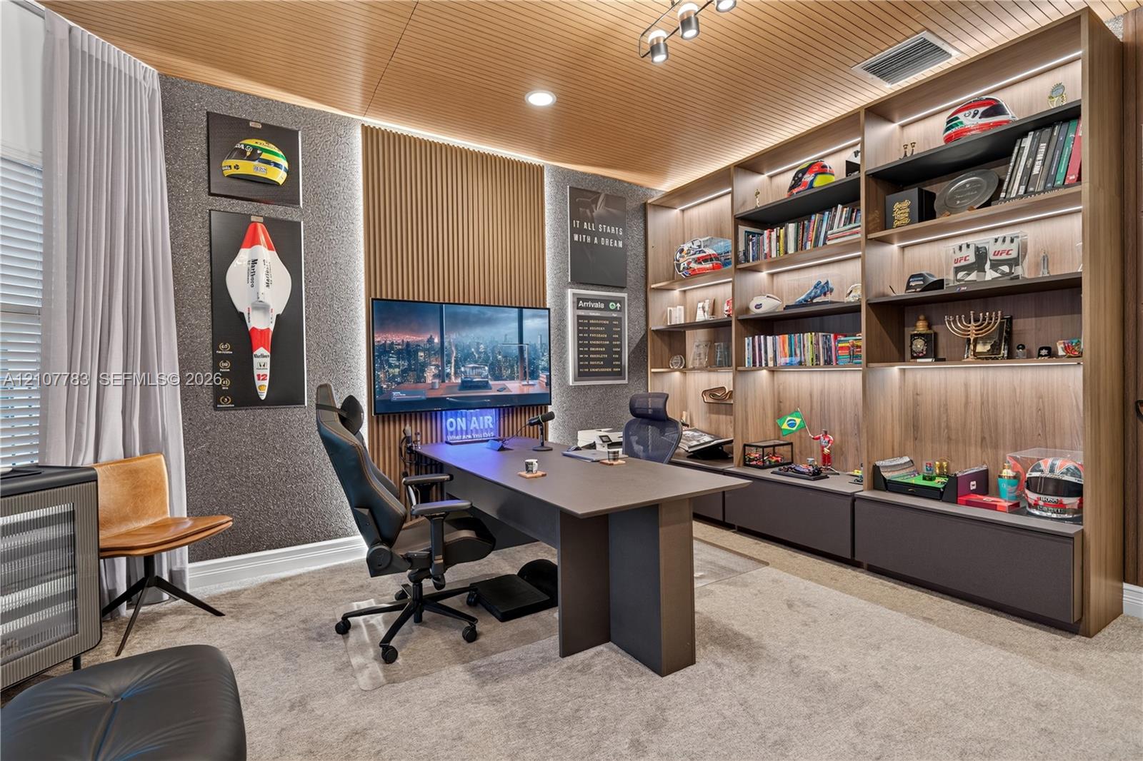 Custom floor-to-ceiling wooden shelving with integrated LED display lighting, slat-wood ceiling detail, vertical wall paneling, and wall-mounted track lighting