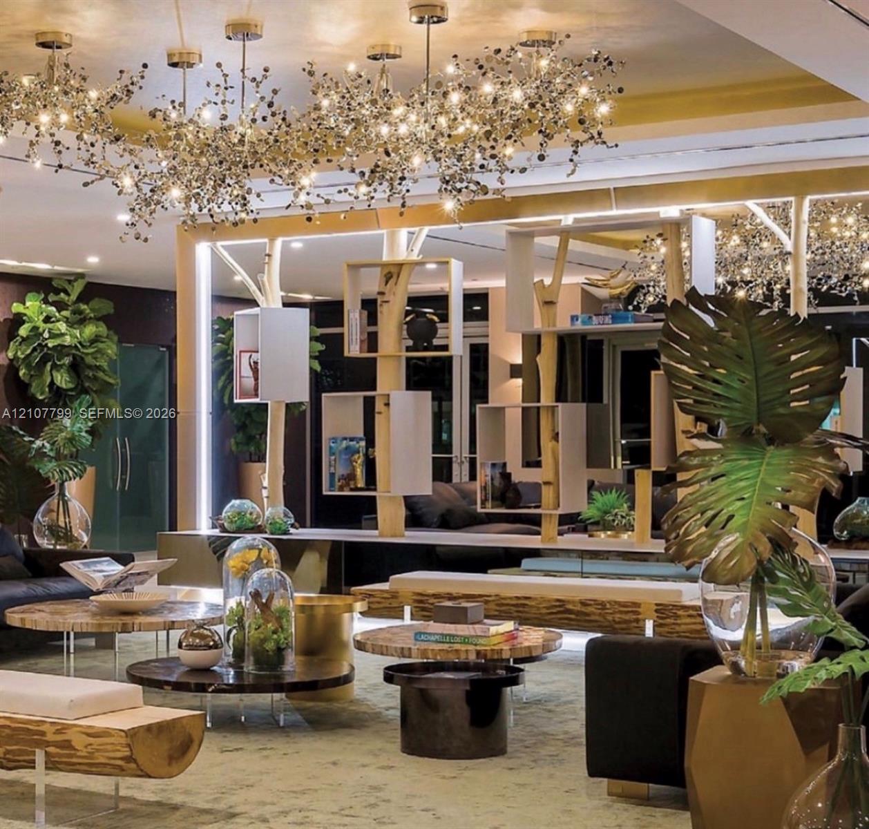 Custom multi-light cluster chandeliers, floor-to-ceiling built-in wooden shelving units, and integrated linear LED accent lighting