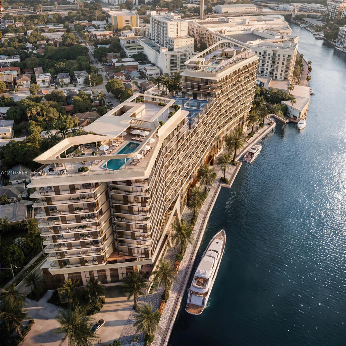 Waterfront high-rise building featuring multiple rooftop swimming pools, wrap-around balconies, a private boat slip, and landscaped grounds with palm trees