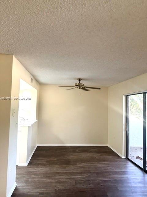 Interior space featuring wood-finish flooring, a ceiling fan with integrated lighting, and sliding glass doors