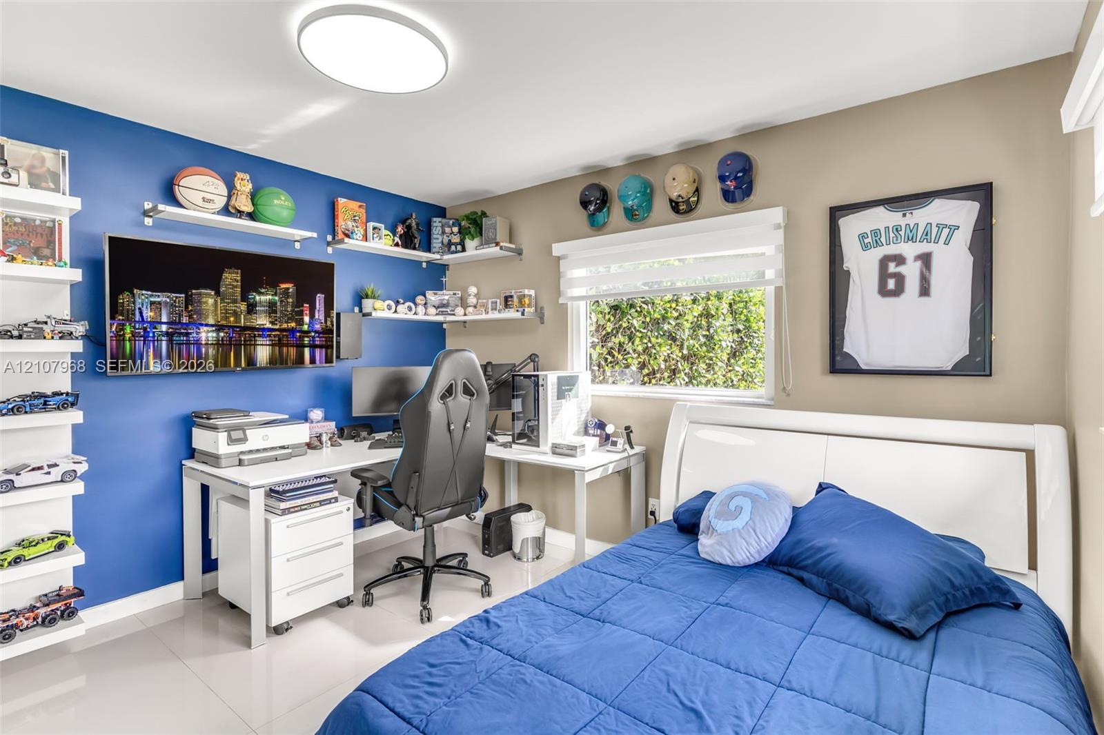 Room featuring large-format tile flooring, multiple wall-mounted floating shelves, and a modern circular flush-mount ceiling light