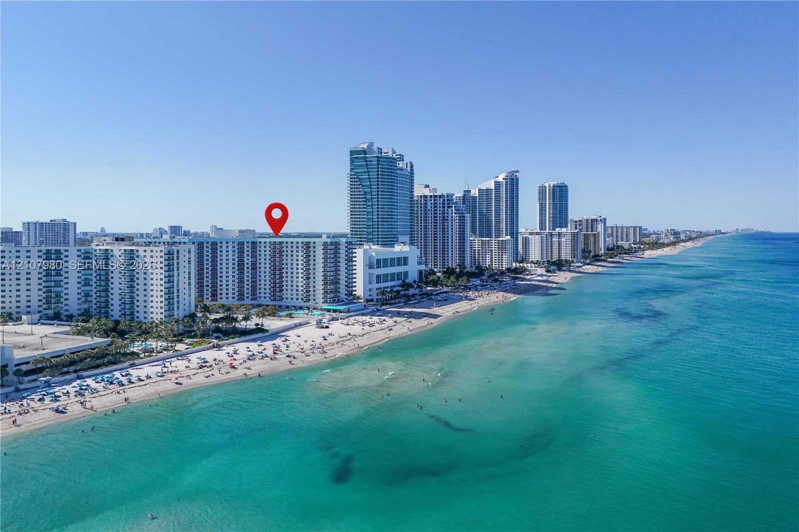 High-rise residential building situated on the Atlantic coastline featuring direct beach access and proximity to regional urban centers