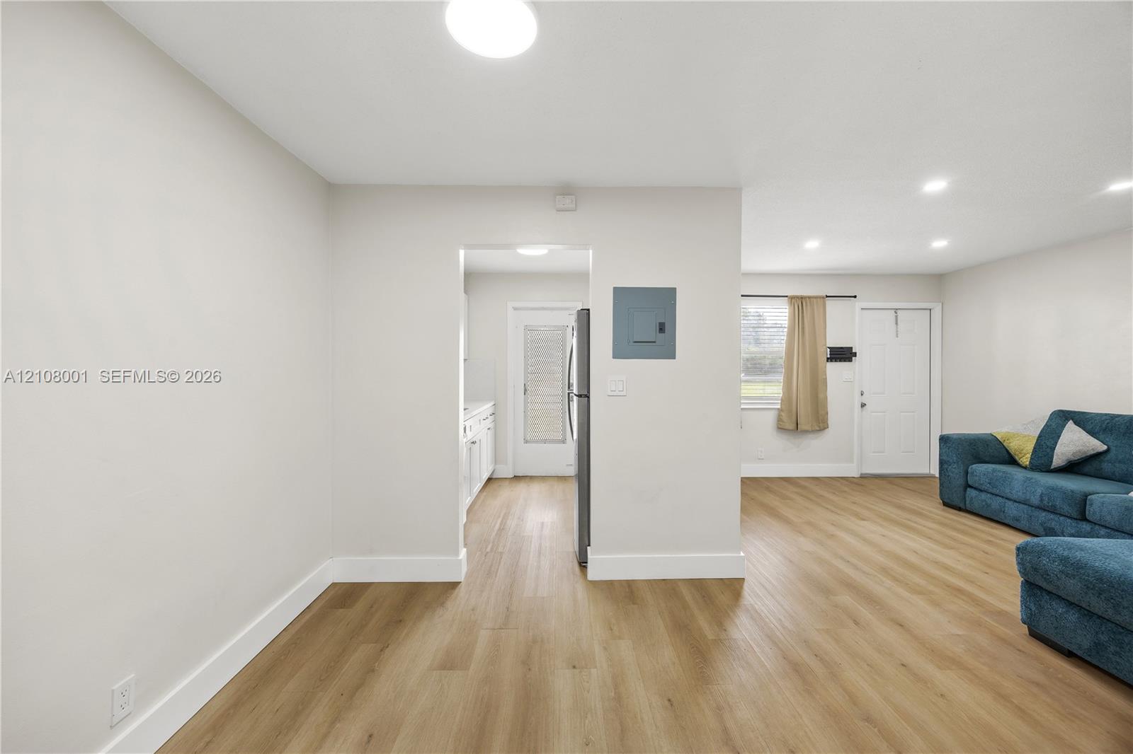 Interior space featuring wood-finish flooring, neutral wall paint, and recessed lighting throughout