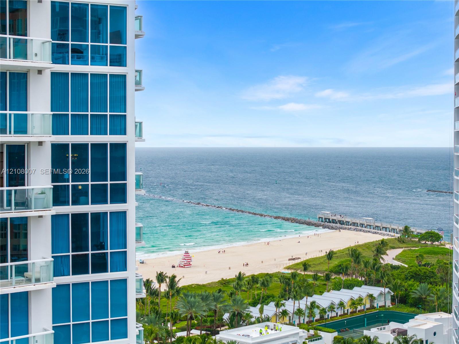 High-rise exterior featuring floor-to-ceiling glass windows and multiple private balconies