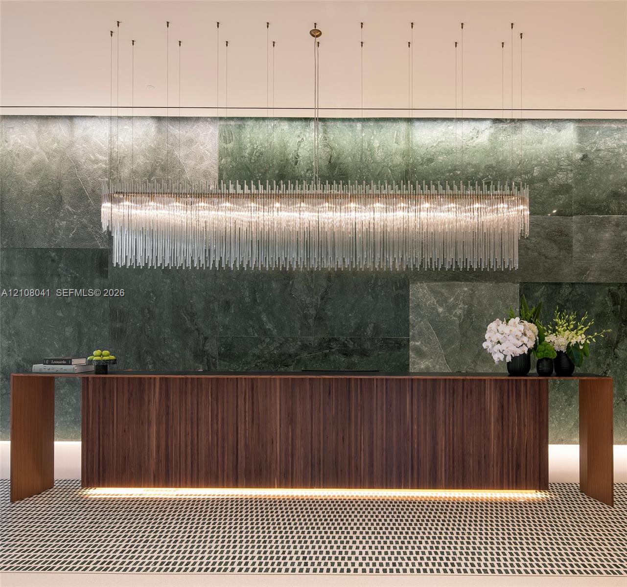 Wood-paneled reception desk with integrated lighting
