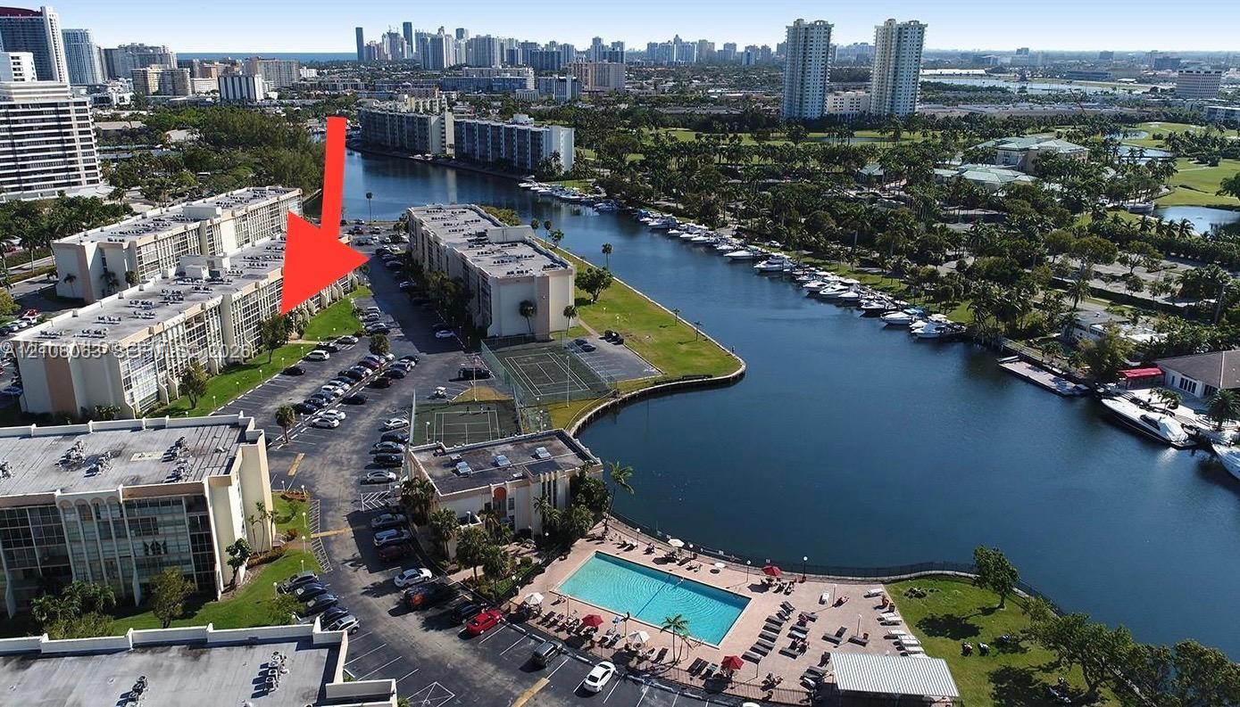BUILDING AERIAL VIEW (Arrow shows the unit's balcony location) BUILDING AERIAL VIEW (Arrow shows the unit's balcony location)