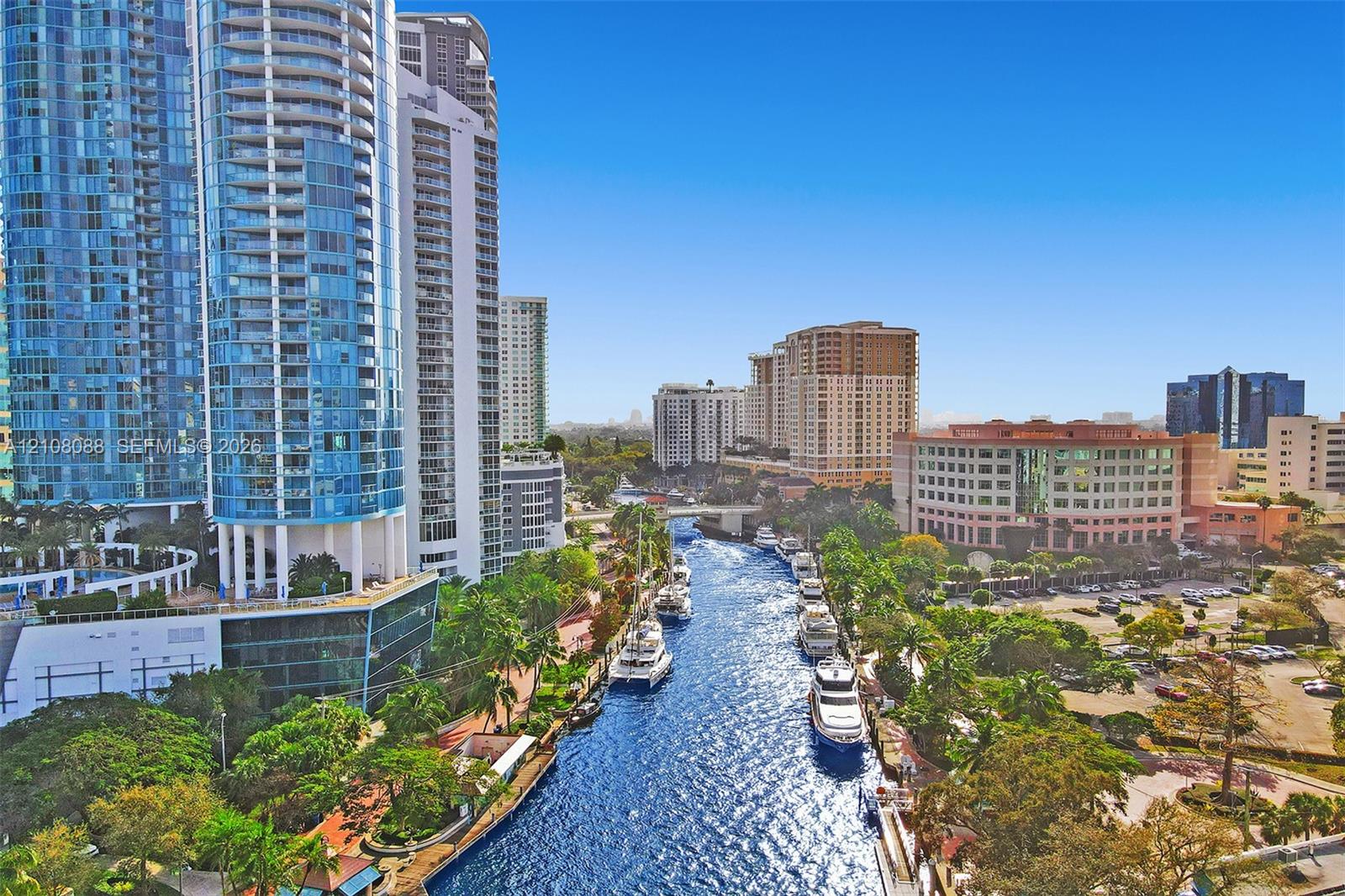 Urban waterfront setting featuring high-rise architecture, deep-water canal access, and matured tropical landscaping Urban waterfront setting featuring high-rise architecture, deep-water canal access, and matured tropical landscaping