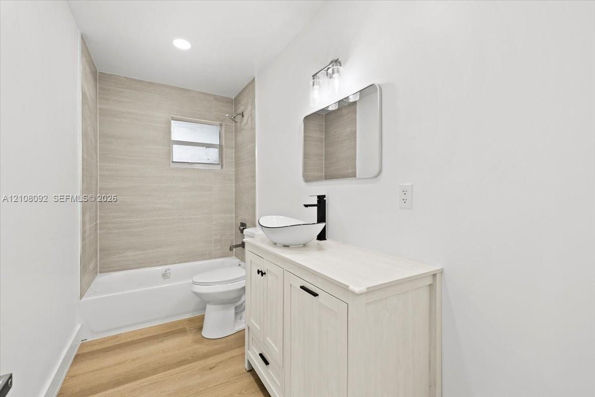 Interior space featuring light-toned wood-finish flooring, recessed lighting, and a large picture window