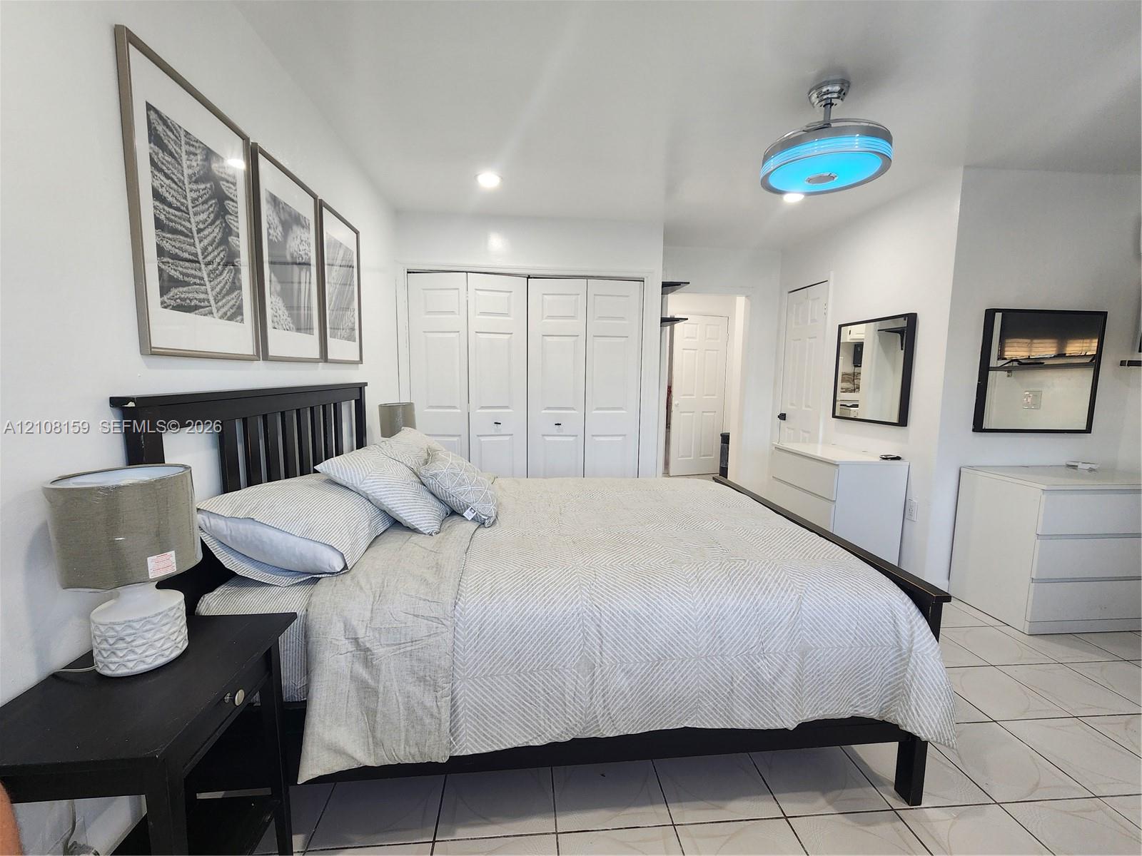 Tile flooring, bi-fold closet doors, and recessed ceiling lighting