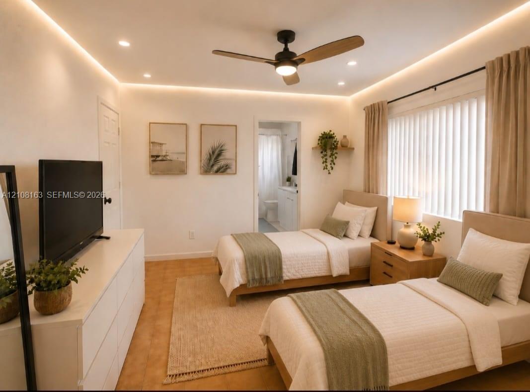 Interior space featuring recessed ceiling lighting, perimeter cove lighting, a three-blade ceiling fan, and large-format tile flooring