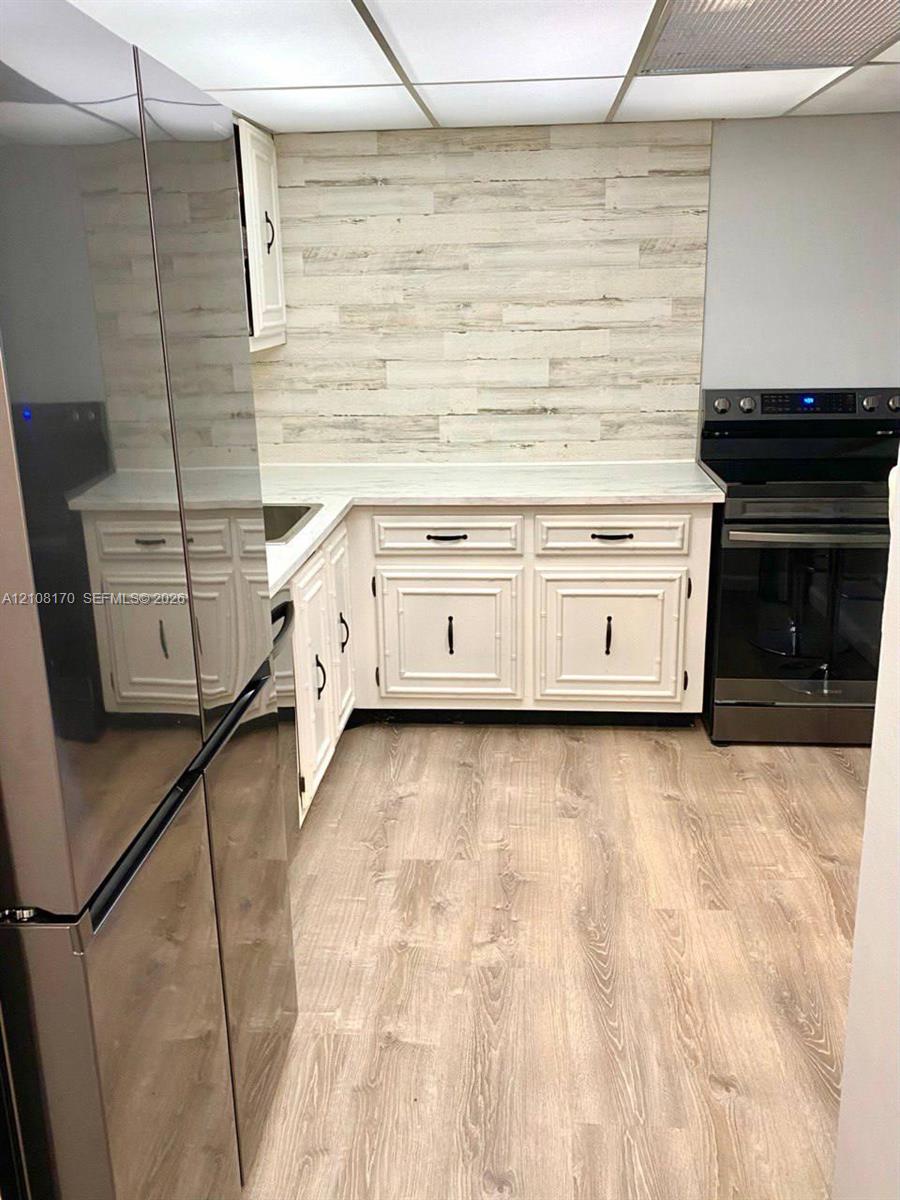 Updated Kitchen Flooring and Backdrop
