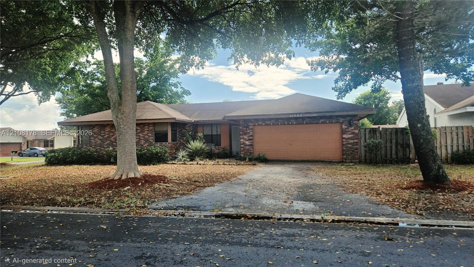 Single-story residence featuring a brick exterior, attached two-car garage, and mature landscaping Single-story residence featuring a brick exterior, attached two-car garage, and mature landscaping