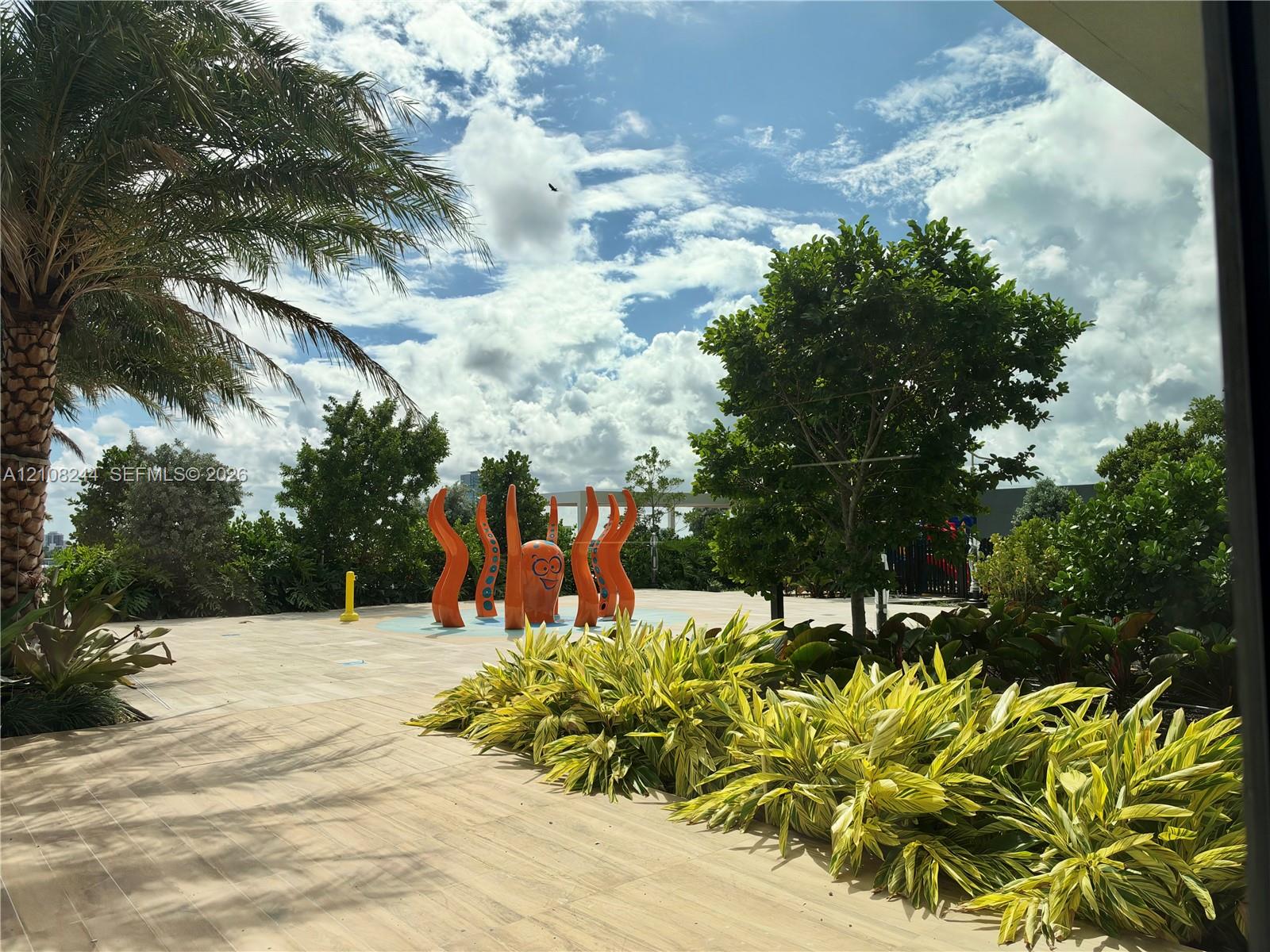 Resort-style pool deck featuring a swimming pool, sun terrace, and structured cabanas