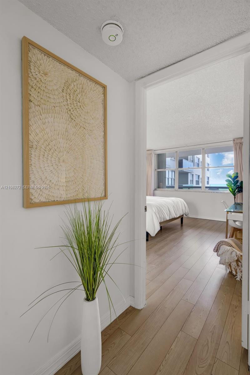 Interior space featuring wood-finish flooring and large multi-pane windows