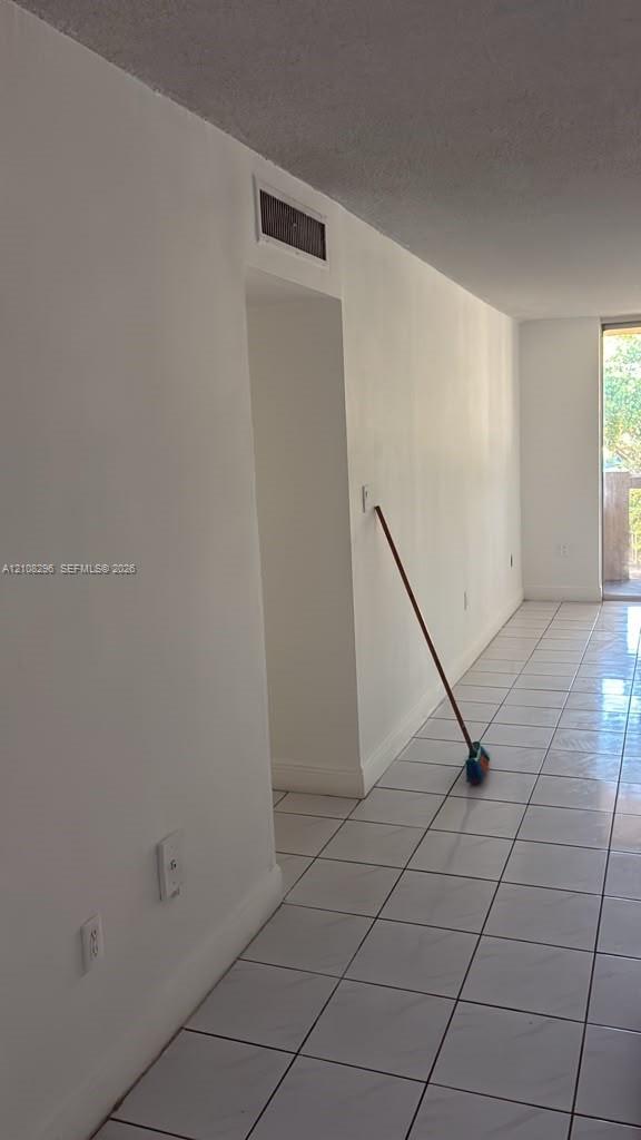 Ceramic tile flooring and neutral wall finishes