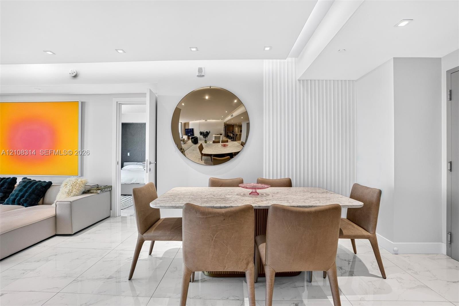 Polished stone-finish flooring, vertical fluted wall paneling, and recessed ceiling lighting Polished stone-finish flooring, vertical fluted wall paneling, and recessed ceiling lighting