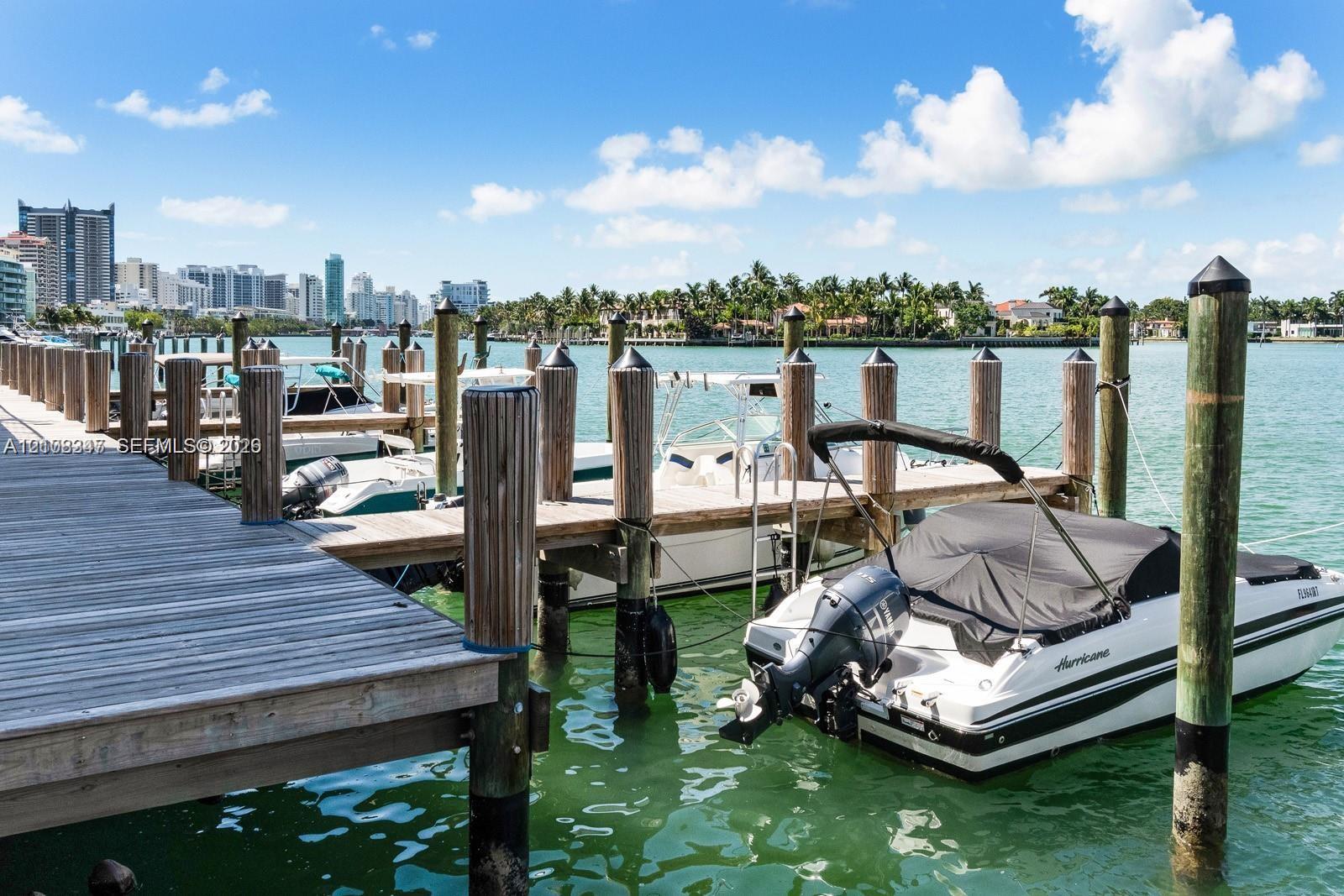 Private wooden boat dock featuring multiple deep-water slips and sturdy marine pilings