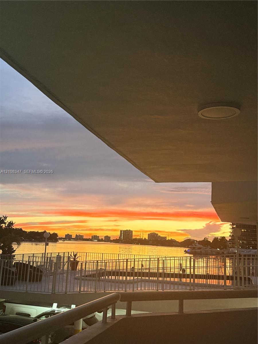 Covered terrace recessed ceiling lighting, and expansive water backdrop