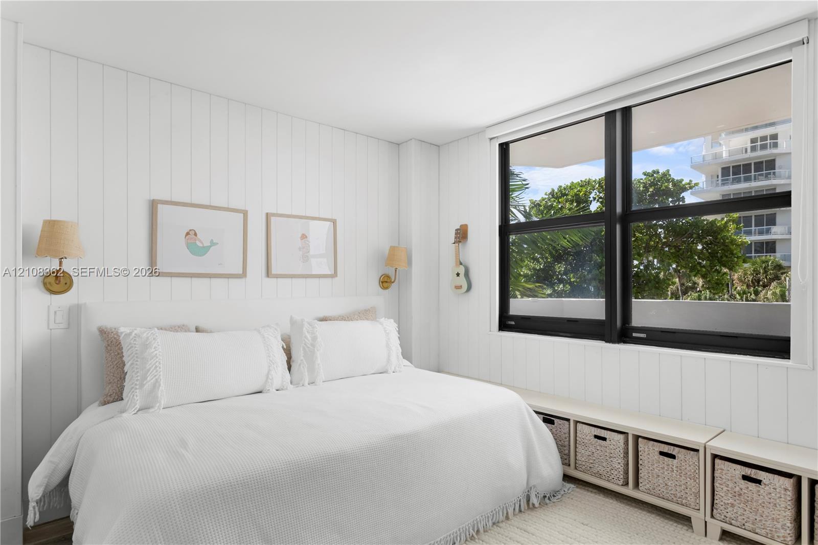 Vertical wood paneling, large windows with black frames, and integrated wall-mounted light fixtures