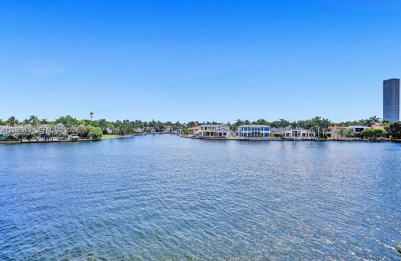 Waterfront parcel featuring extensive canal frontage, deep-water access, and tropical landscape