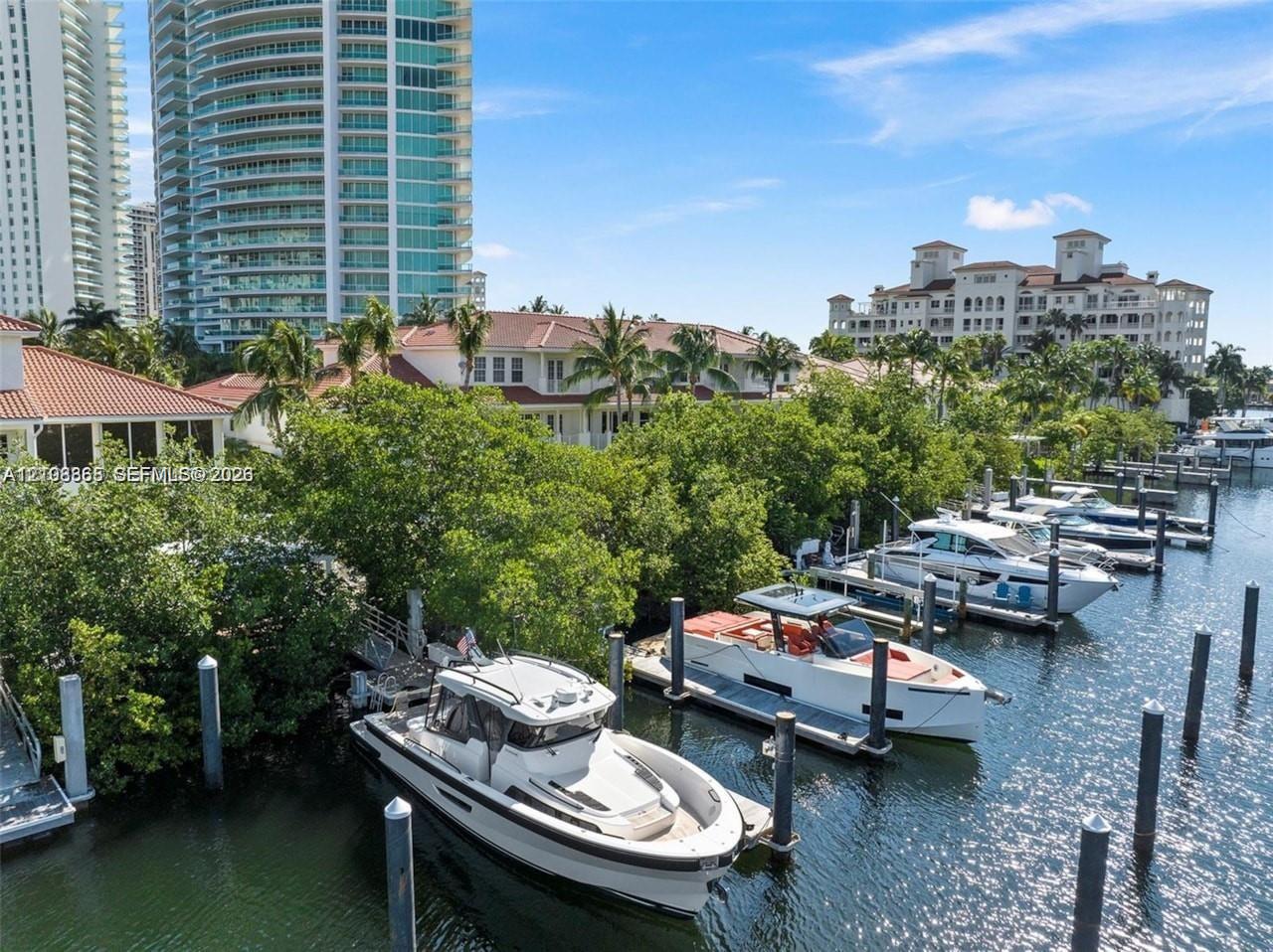 Deep-water canal access featuring multiple fixed pilings and a private docking area