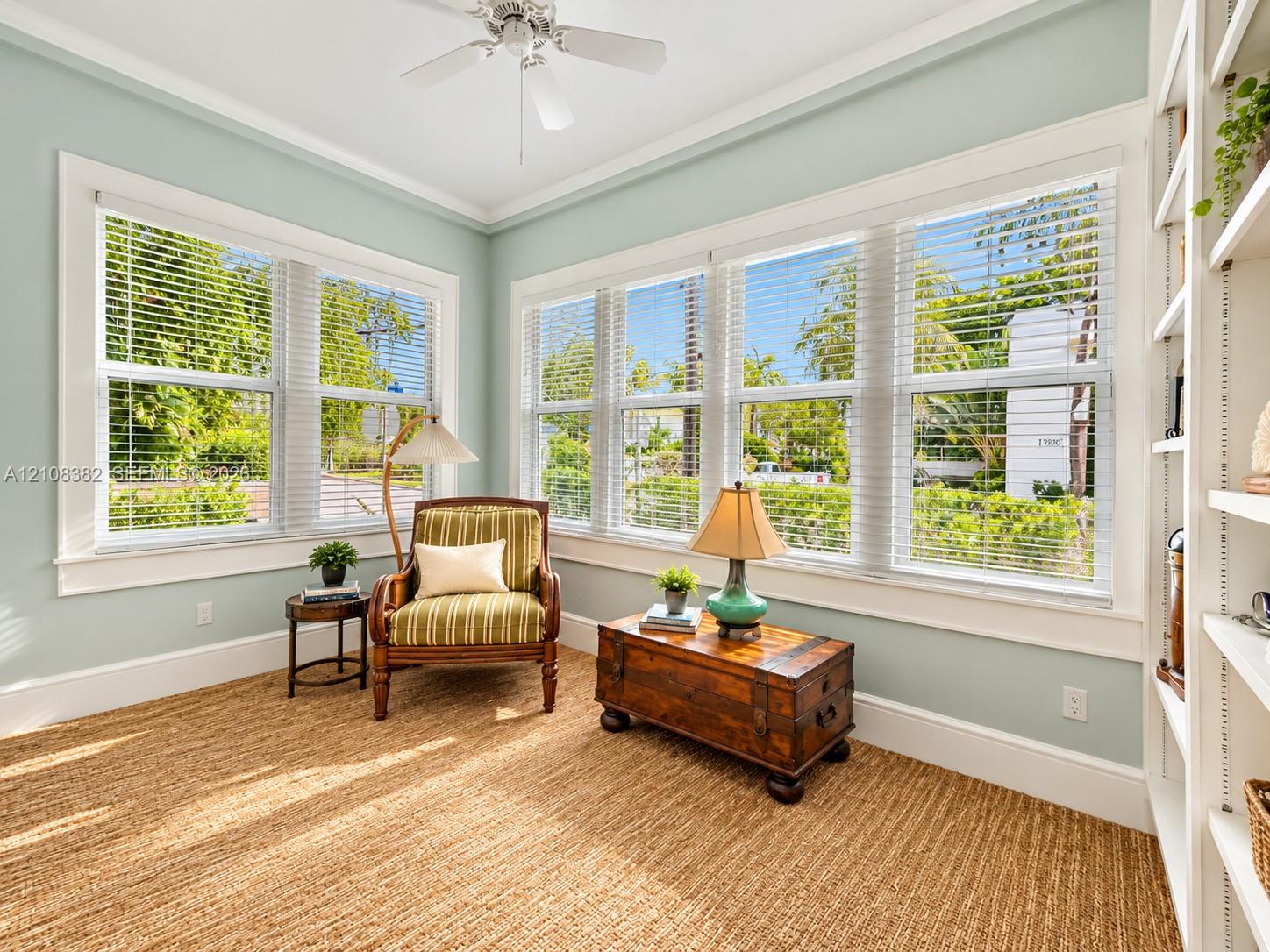Multi-pane windows, built-in shelving, white ceiling fan, and extensive trim work Multi-pane windows, built-in shelving, white ceiling fan, and extensive trim work