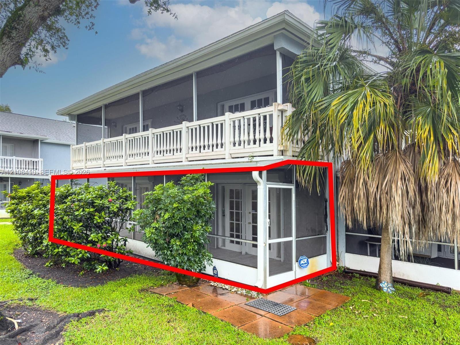 Ground-level screened-in porch featuring aluminum framing and multi-panel glass entry doors Ground-level screened-in porch featuring aluminum framing and multi-panel glass entry doors