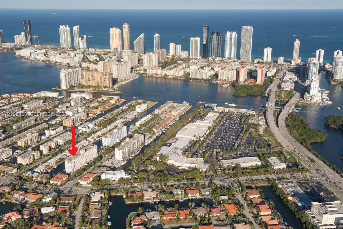 Aerial perspective featuring proximity to coastal waterways and high-density urban infrastructure Aerial perspective featuring proximity to coastal waterways and high-density urban infrastructure