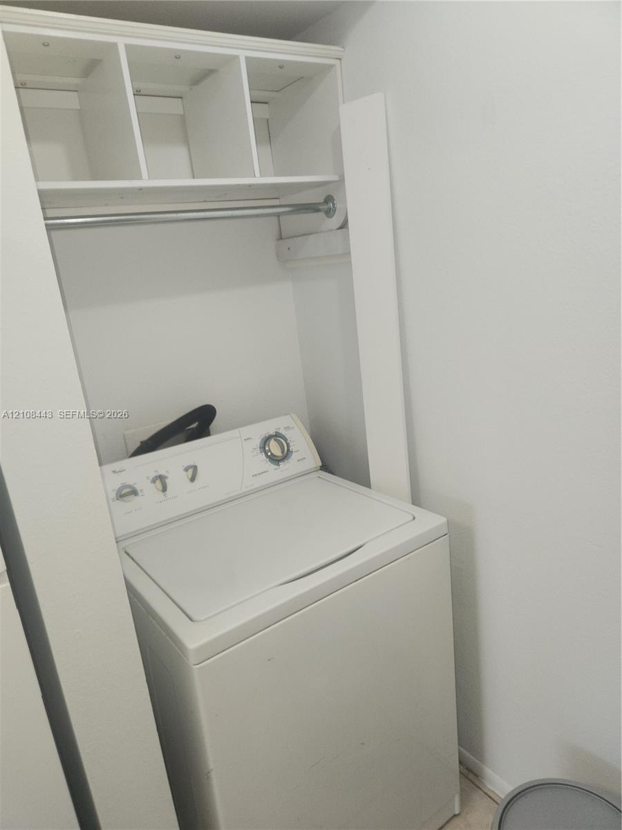 Built-in overhead shelving with an integrated metal clothing rod