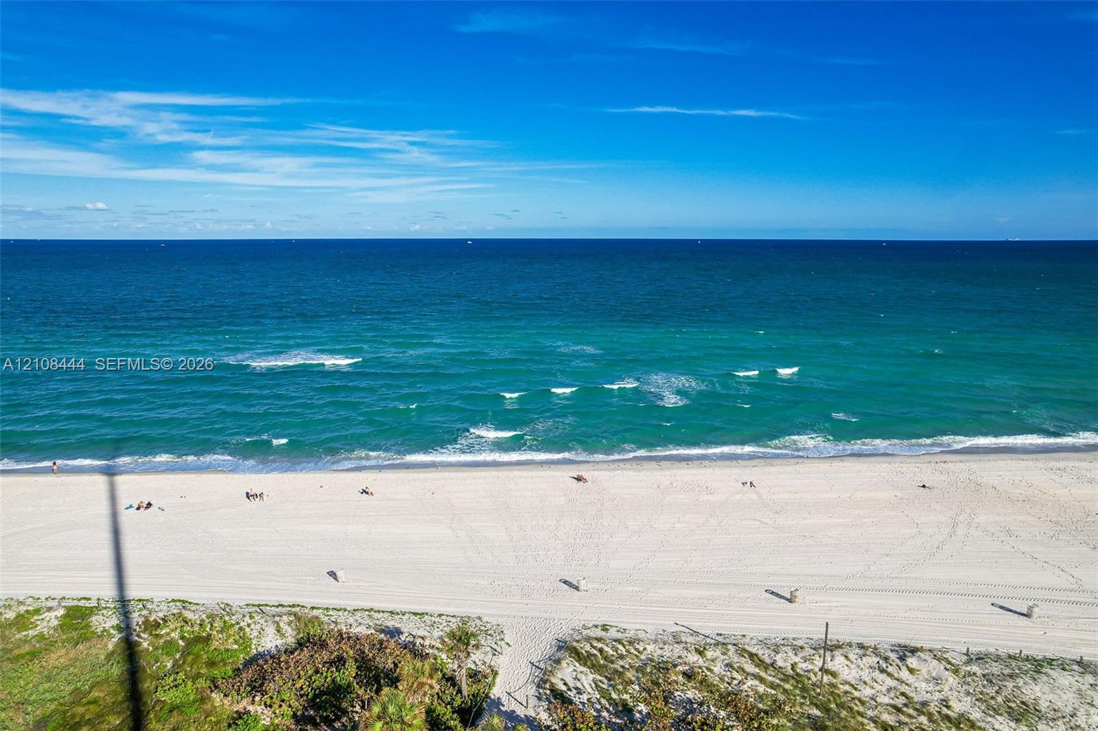 Oceanfront parcel featuring expansive sandy beach, dunes, and direct water access