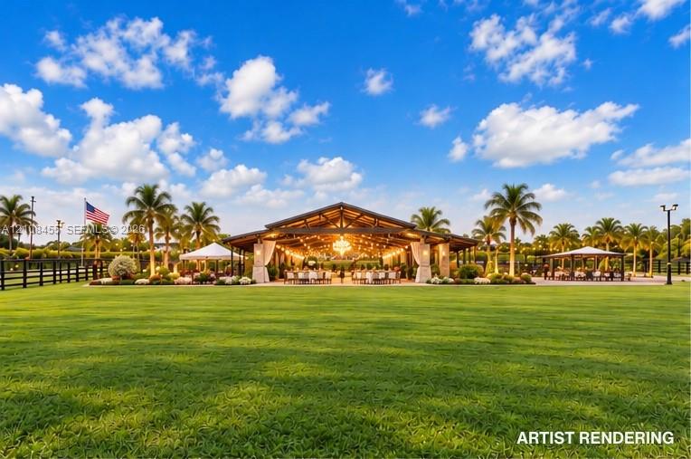 Expansive landscaped lawn featuring mature palm trees, a covered open-air pavilion with exposed timber trusses, stone support columns, and permanent exterior lighting